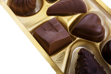 A collection of mixed chocolates against a white background