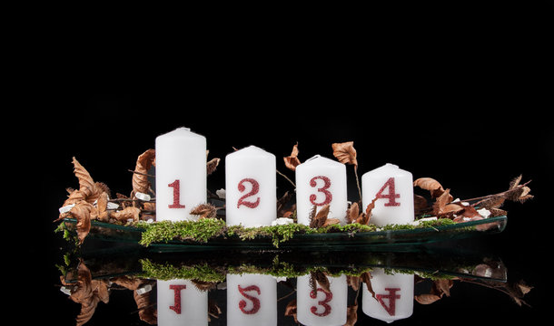 Advent candles on a black background