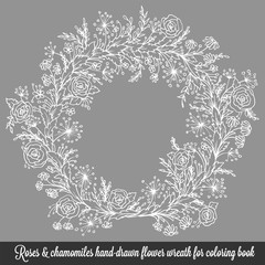 Laurel wreath frame with roses, chamomiles and flourishes. Decorative vintage element in engraving style, hand-drawn floral doodle decor for cards or design.