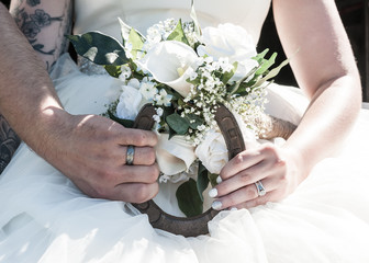 Country wedding holding horseshoe