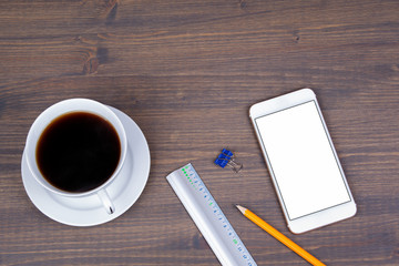 Top view of Cup of coffee with smart phone on wooden background. Technology, successful business and advertising concept