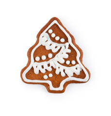 Gingerbread in the form of christmas tree - homemade sweet cookie, isolated on white background