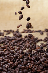 Spilling out coffee beans from cup