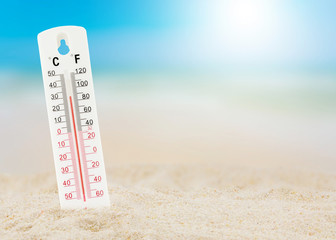thermometer on beach, concept world hot