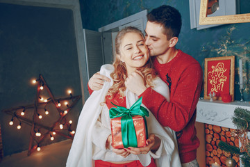 loving couple decorating Christmas tree