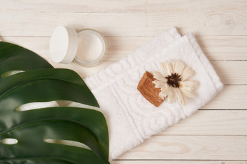 napkin, flower, background of boards, jar, green leaf