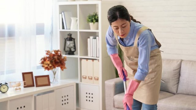 Happy Young Woman Cleaning Floor