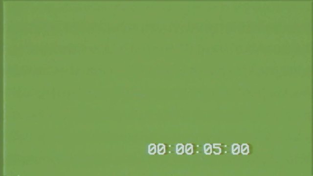 An old bad VHS tape playing. Green screen with timecode. A vintage background for videos, a retro element.
