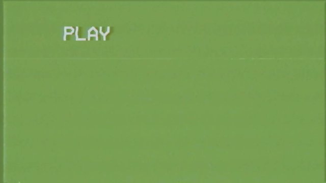 An old bad VHS tape playing. Green screen with PLAY text only. A vintage background for videos, a retro element.
