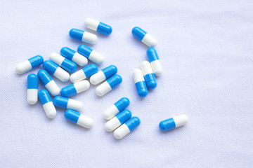 Capsules on a white cloth