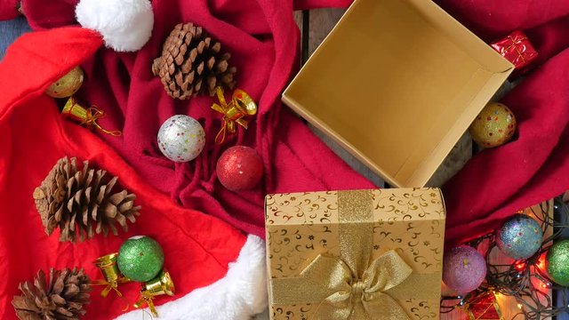Top view of open empty gift box and christmas decoration on the table. 