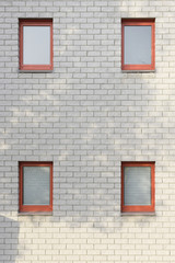 Fototapeta na wymiar White brick wall with windows
