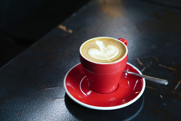 Hot latte coffee with red cup