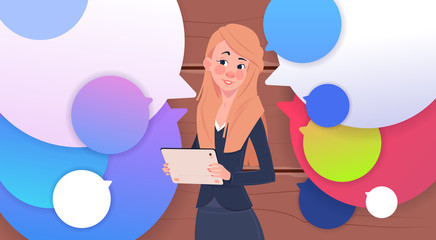 Businesswoman Holding Tablet Speak Over Colorful Chat Bubbles Flat Vector Illustration