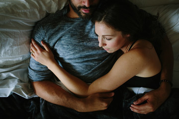 Black and white couple sleeping