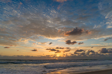 Fototapeta na wymiar Picturesque ocean beach on sunrise, sunset