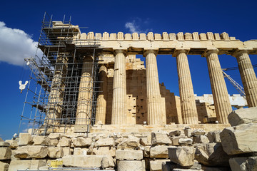 Restoration work in progress at beautiful world heritage classical Parthenon on marble block base...