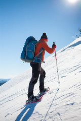 Climber in the winter mountains.