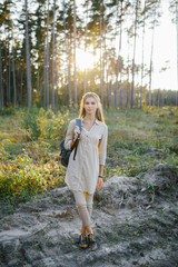 Young girl walking in the forest