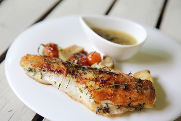 Sea bass fillet on wood background