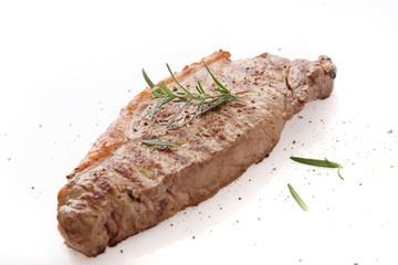 Grilled Beef Steak with pepper and rosemary isolated in white background