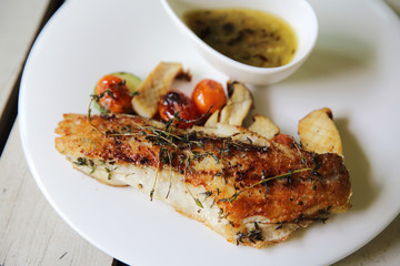 Sea bass fillet on wood background