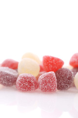 Colorful jelly sugar candies close up isolated in white background