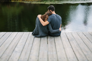 couple holding each other on the dock