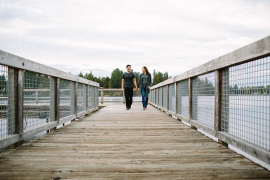 Couple in love walking on the boardwalk 