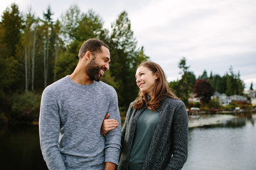 Couple cuddling at the lake