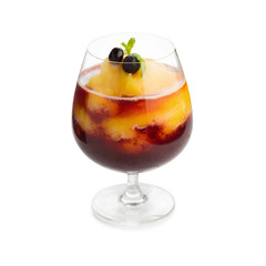 Fruit juice and berries on wooden background