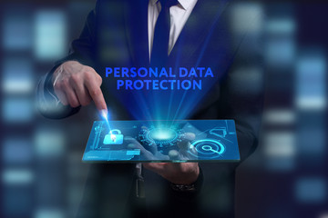 Business, Technology, Internet and network concept. Young businessman working on a virtual screen of the future and sees the inscription: Personal data protection