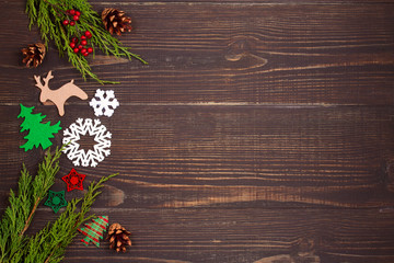 Christmas and New Year background. Winter holidays concept with decorations on wooden background. View from above, top studio shot, horizontal