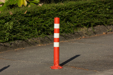 Orange traffic pole on road for safety Area