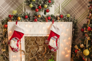 christmas room interior design  fire place with Santa socks decorated by lights