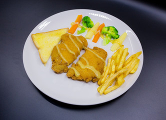 Fried fish steak in plate