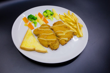 Fried fish steak in plate