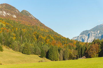 Fototapeta na wymiar Picturesque autumnal landscape view on the mountains in Val di Sella, Borgo Valsugana, Trentino, Italy, Europe