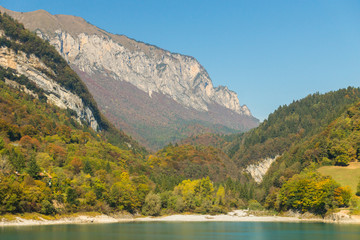 Fototapeta premium Fresh transparent emerald green water of Tenno lake in Trentino, Italy, Europe