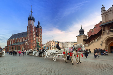 Fototapeta Horse carriages at the Main Square in Krakow, Poland obraz