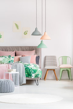 Pastel bedroom with different chairs