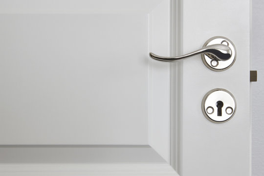 Metallic Door Knob On A Classic White Door. Home