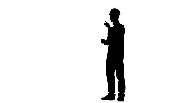 Builder talks to the contractors. Silhouette. White background
