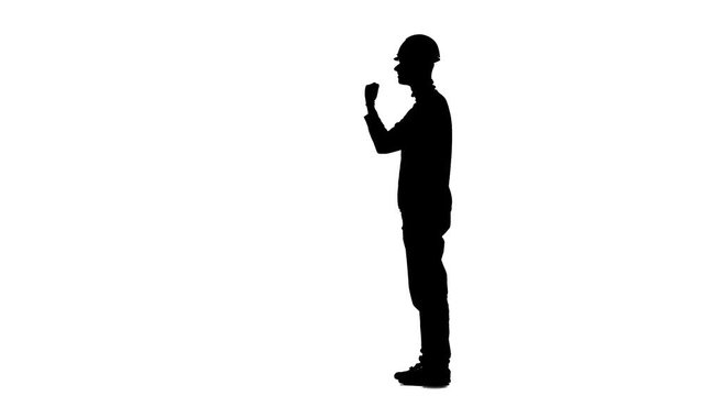 Foreman screams at his subordinates at the construction site. Silhouette. White background