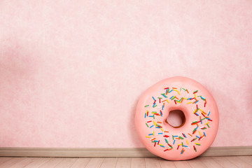 Big donut on pink background candy sweet