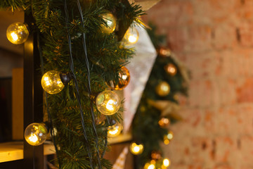 christmas decorative gifts toys stars garland and fire in background bokeh lights holiday concept