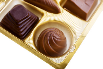 A collection of mixed chocolates against a white background