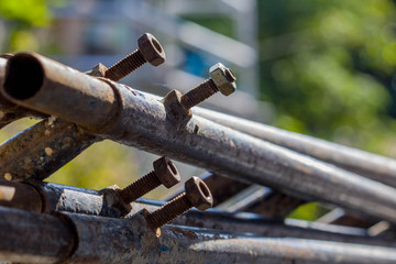 close-up Screw, bolt and nut Welded to a steel pipe
