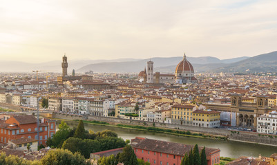 Fototapeta na wymiar Florence city panorama with Arno river and Santa Maria del Fiore cathedral at sunset.