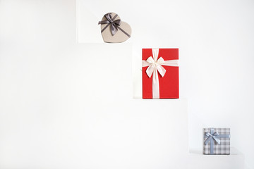 Gift boxes on white steps. Sale of gifts.